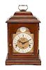 An English Mahogany Table Clock Height 16 1/2 x width 10 x depth 6 1/2 inches.