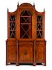 An Edwardian Satinwood Breakfront Bookcase Height 90 1/2 x width 57 3/4 x depth 18 inches.