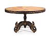 An Anglo-Colonial Style Various Woods Center Table Height 32 1/2 x diameter of top 54 1/4 inches.