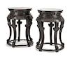A Pair of Chinese Carved Wood Pedestal Tables Height 33 1/2 x diameter of top 24 inches.