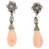 A coral and diamond palladium silver pair of earrings.