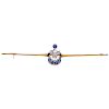 A diamond and sapphire 10K yellow gold brooch.