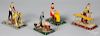 Four painted tin worker steam toy accessories