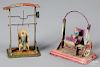 Two painted tin carnival steam toy accessories