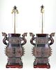 A pair of Archaic style lamps.
