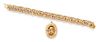 A 14 Karat Yellow Gold Double Curb Link Bracelet and Unattached Charm, 37.90 dwts.