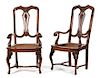 A Pair of Italian Carved Walnut Open Armchairs Height 44 x width 23 x depth 21 inches.