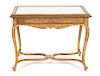A Louis XV Style Carved Giltwood Center Table Height 30 x width 39 1/2 x depth 25 inches.