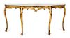 A Louis XV Style Carved Giltwood Serpentine Console Table Height 32 x width 65 inches.
