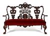 An Irish Chippendale Style Mahogany Settee Height 48 1/2 x width 72 1/2 x depth 25 inches.
