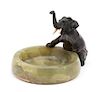 A Green Onyx Ashtray Mounted with a Bronze Elephant Height 6 x diameter 6 1/2 inches.