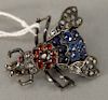 Silver fly brooch set with diamonds, blue, and red stones. lg. 31.9mm