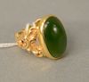 14 karat gold ring, set with cabochon cut green jadeite. size 7, 8.5 grams