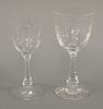 Set of twenty four Hawkes etched crystal stems to include set of eleven large red wine glasses (ht. 8 in.) and a matching set of twe...