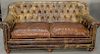 Leather sofa with tufted back. wd. 71 in.