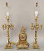 Three piece brass clock set with candelabra lamps. ht. 37 in.
