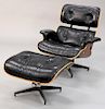 Herman Miller leather lounge chair and ottoman, signed.