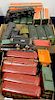 Three sets of Lionel trains, red passenger cars, two sets of green passenger cars, three with original boxes.