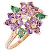 An amethyst, emerald and diamond 14K yellow gold ring.