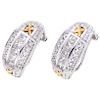 A diamond platinum and 18K yellow gold pair of earrings.
