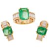 An emerald and diamond 18K yellow gold ring and pair of earrings set.