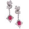 A ruby and diamond platinum and palladium silver pair of earrings.