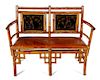 An English Victorian Bamboo Settee Height 37 3/4 x width 48 1/4 x depth 19 inches.