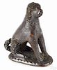 Pennsylvania redware seated spaniel, 19th c., with a manganese glaze, 4 1/4'' h.