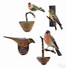 Four carved and painted songbirds, early 20th c., on twig perches, tallest - 7 3/4''.
