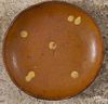 Pennsylvania redware pie plate, 19th c., with yellow slip dots, 8 7/8'' dia.