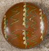 Pennsylvania redware pie plate, 19th c., with green and yellow slip decoration, 9 1/4'' dia.