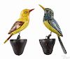 Pair of carved and painted songbirds, early 20th c., on pine perches, 7'' h.