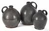 Graduated set of three redware ovoid jugs, 19th c., 8 1/2'' h., 8'' h., and 7'' h.