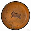 Pennsylvania redware plate, 19th c., with a slip decorated running rabbit, 7 1/2'' dia.