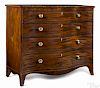Federal mahogany chest of drawers, ca. 1805, with a serpentine front and overall line inlay