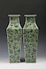 PAIR OF GREEN GROUND FAMILLE-ROSE VASES, QIANLONG MARK