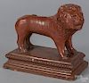 Redware figure of a lion, early 20th c., probably English, standing atop a plinth base