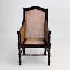 Continental Ebonized and Caned Armchair