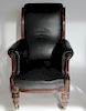 Antique Leather Upholstered High back Arm Chair.