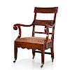 A George III ebony lined mahogany armchair