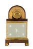 A Charles X  bronze and glass mantel clock