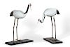A pair of porcelain and  metal standing cranes