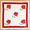 Appliqué quilt with red flowers