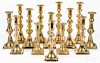 Seven pairs of English Victorian brass candlesticks