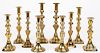 Five pairs of English Victorian brass candlesticks