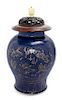 A Gilt Decorated Blue Glazed Porcelain Covered Jar Height 17 inches.