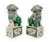 A Pair of Famille Verte Porcelain Figures of Fu Lions Height 12 1/4 inches.