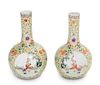 * A Pair of Yellow Ground Famille Rose Porcelain Bottle Vases Height of each 9 inches.