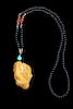 A Yellow and Celadon Jadeite Pendant Length 2 1/8 inches.