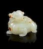 A Celadon and Russet Jade Carving of a Mythical Beast, Bixie Length 1 5/8 inches.